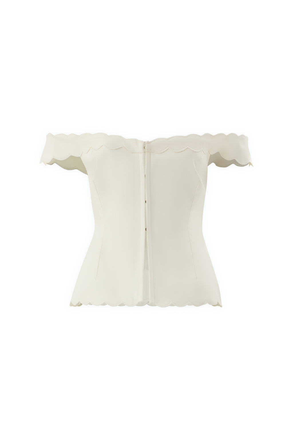 The IVORY MUSE TOP is an off-the-shoulder white corset with scalloped edges, wave embroidery on the neckline, sleeves, and hem, a sculpted silhouette, and a back zipper closure.