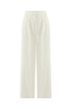 IVORY FLOW PANTS: High-waisted, wide-leg ivory trousers with pleats, side pockets, a tailored fit, and crafted from a soft cotton-tencel blend. Displayed against a plain white background.